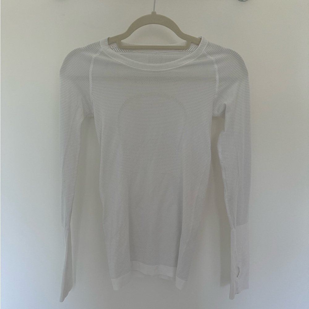 Lululemon white long sleeved tee. Size 2. Perfect condition.